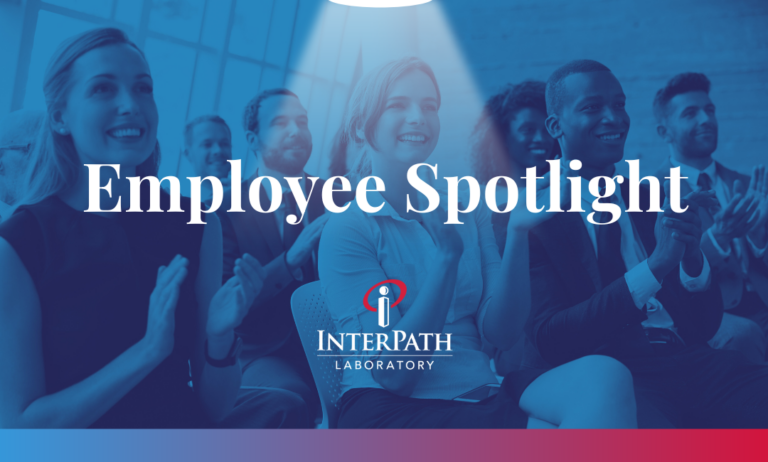 Employee Spotlight, professional workers smiling and applauding looking off camera
